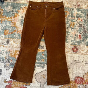 Brown corduroy flare leg pants. 7 For All Mankind.